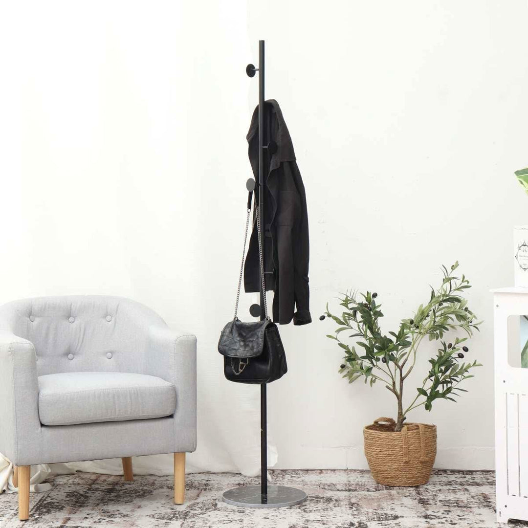 Clothing Rack with Streamlined Freestanding Design and Circular Hooks - Image 1